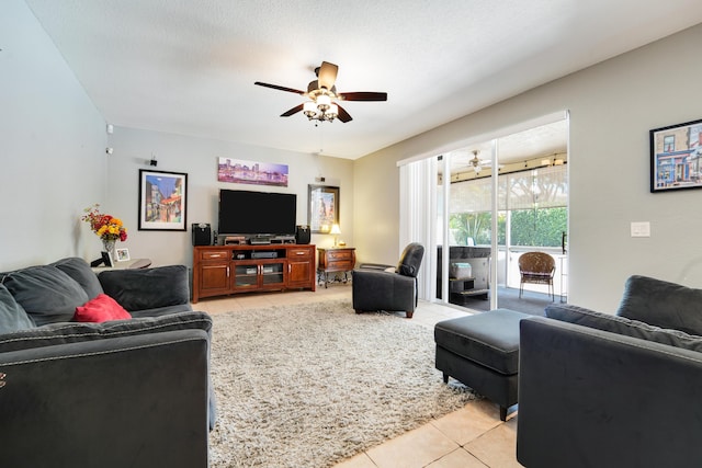 living room featuring light tile patterned floors and ceiling fan