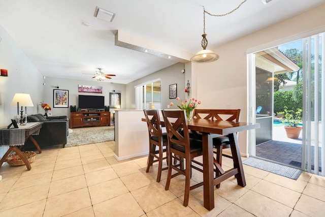 dining room featuring light tile patterned flooring, visible vents, and a ceiling fan