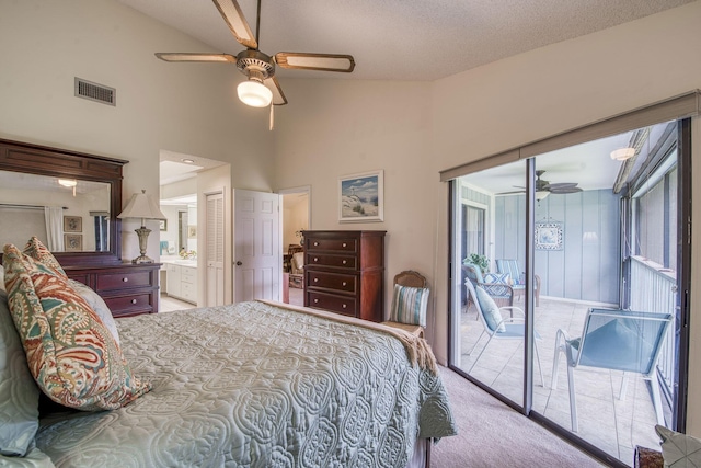 6275 SE Charleston Pl Unit B203, Hobe Sound, FL 33455 - carpeted bedroom featuring access to outside, high vaulted ceiling, ceiling fan, and connected bathroom