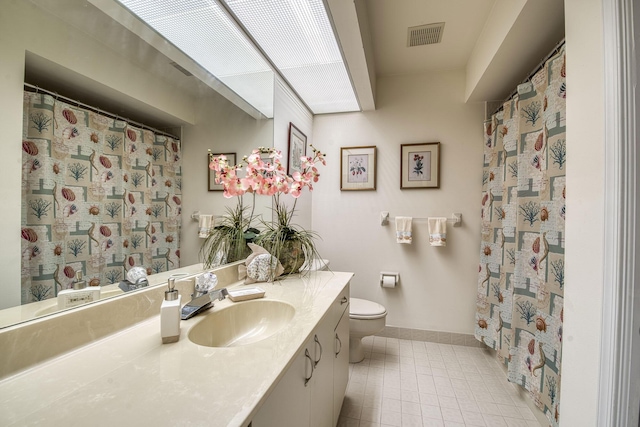 6275 SE Charleston Pl Unit B203, Hobe Sound, FL 33455 - full bathroom featuring baseboards, tile patterned flooring, toilet, and vanity