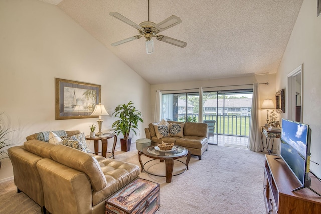 6275 SE Charleston Pl Unit B203, Hobe Sound, FL 33455 - carpeted living room with ceiling fan, a textured ceiling, and high vaulted ceiling