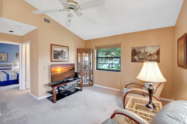 carpeted living area with lofted ceiling, visible vents, ceiling fan, and baseboards