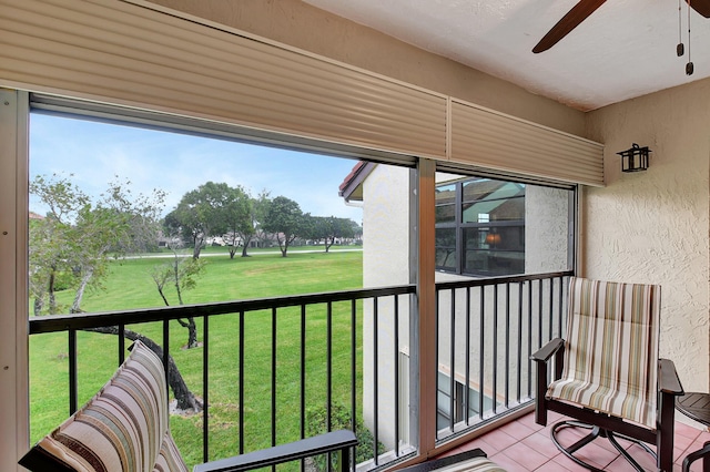 balcony featuring a ceiling fan