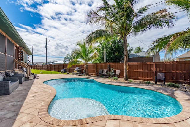 view of pool with a patio area, a fenced backyard, and a fenced in pool