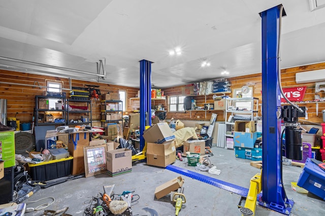 garage featuring a wall mounted air conditioner