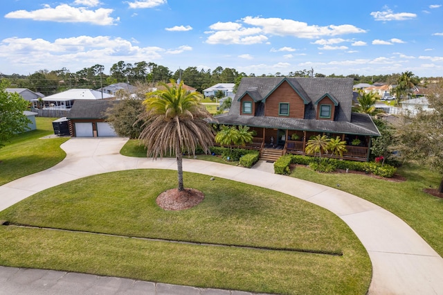 view of front of house featuring a garage, covered porch, a front lawn, and concrete driveway