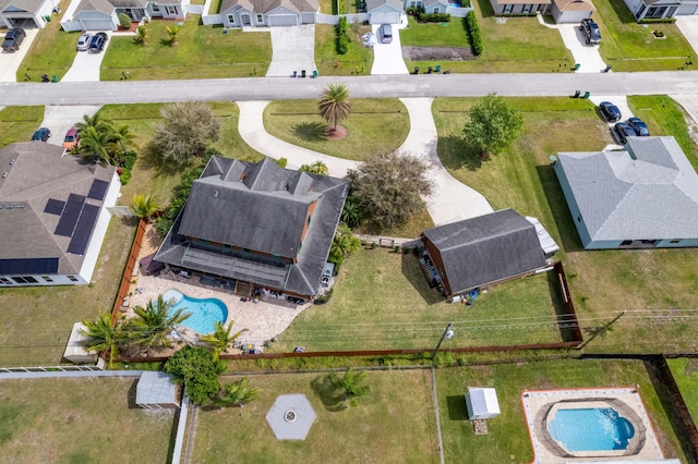 birds eye view of property with a residential view