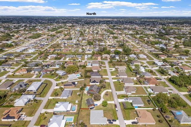 birds eye view of property with a residential view