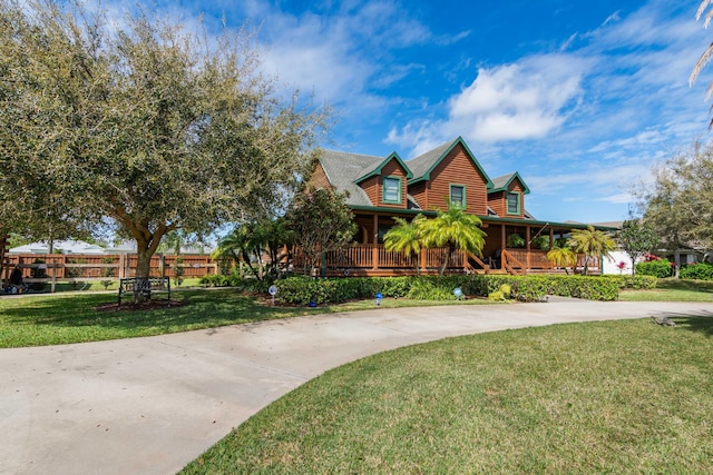 view of front of home featuring covered porch and a front yard