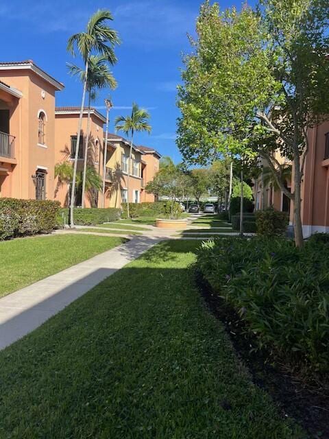 view of property's community with a yard