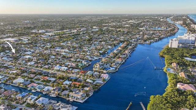 drone / aerial view with a residential view and a water view