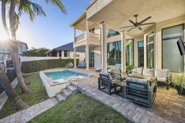 view of pool with a patio, fence, a ceiling fan, a fenced in pool, and an outdoor hangout area