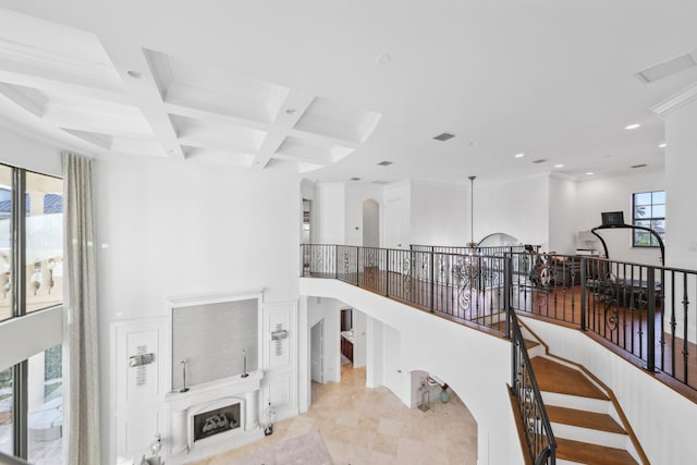 interior space with visible vents, beam ceiling, coffered ceiling, recessed lighting, and crown molding