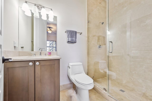 bathroom featuring a stall shower, toilet, vanity, and a ceiling fan