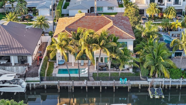 birds eye view of property with a residential view and a water view