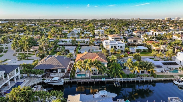 birds eye view of property with a residential view and a water view