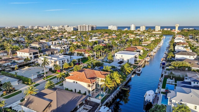 drone / aerial view featuring a water view and a city view