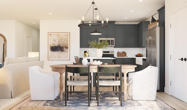 dining space featuring a notable chandelier and recessed lighting