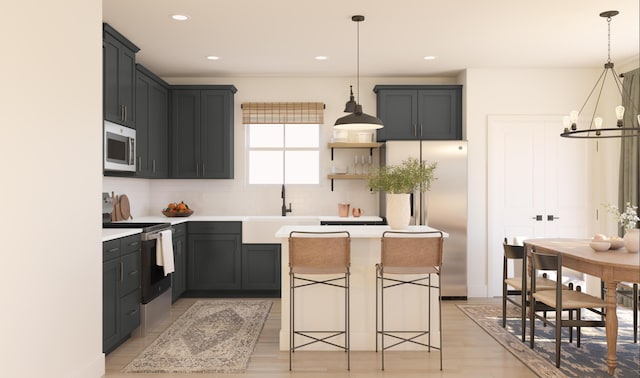 kitchen featuring a sink, a kitchen island, appliances with stainless steel finishes, a notable chandelier, and open shelves