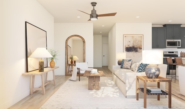 living room featuring recessed lighting, light wood-type flooring, and a ceiling fan