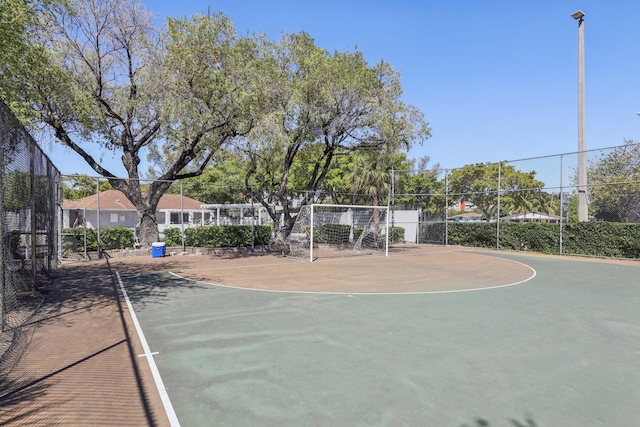 view of sport court with community basketball court and fence