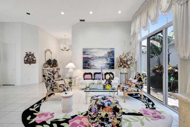 tiled living area featuring visible vents, a notable chandelier, and recessed lighting