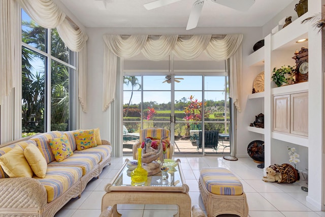 sunroom featuring ceiling fan