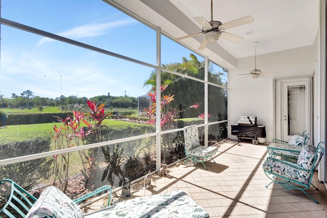 sunroom with ceiling fan and plenty of natural light