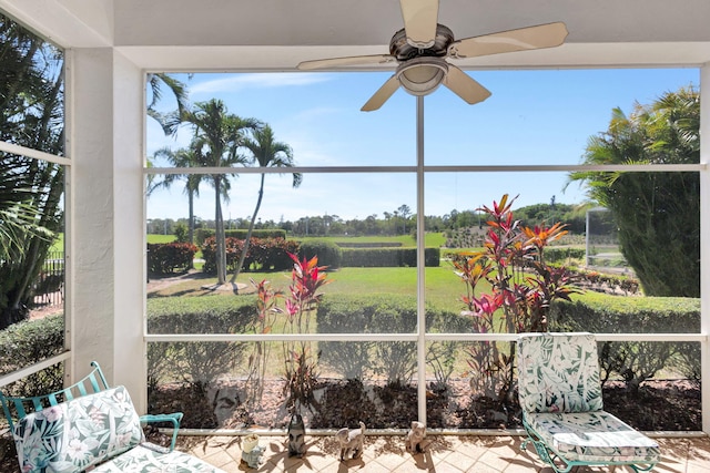 sunroom with a ceiling fan