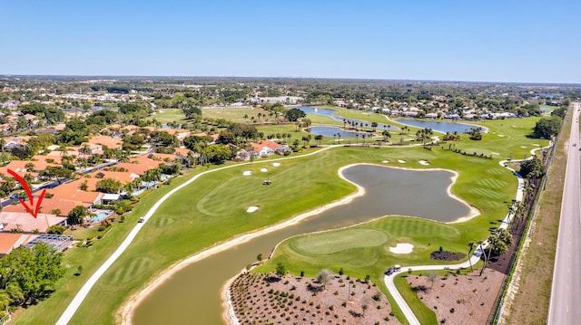 aerial view featuring view of golf course and a water view