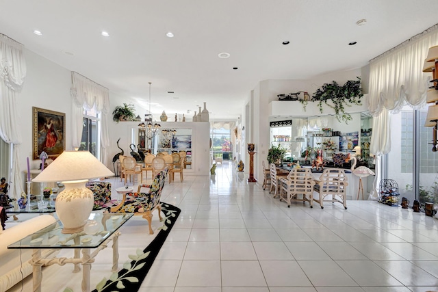 dining room with recessed lighting, a notable chandelier, and light tile patterned floors