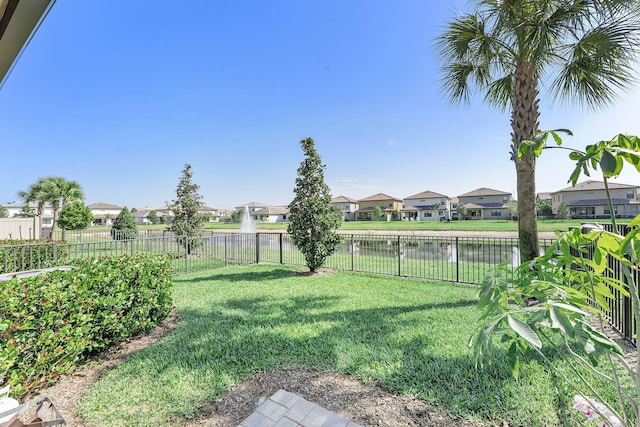 view of yard featuring a residential view and fence