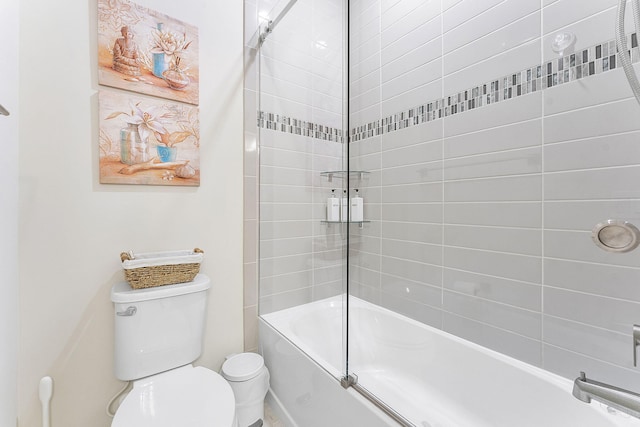 bathroom with toilet and washtub / shower combination