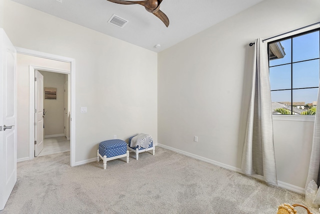 unfurnished bedroom with visible vents, baseboards, a ceiling fan, and carpet flooring