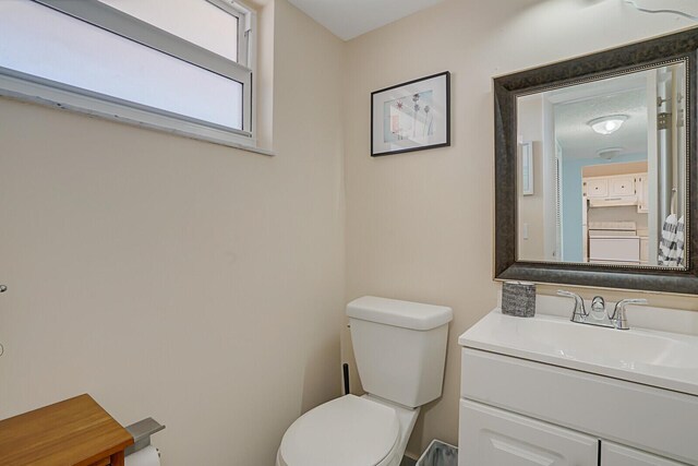 half bath with toilet and vanity