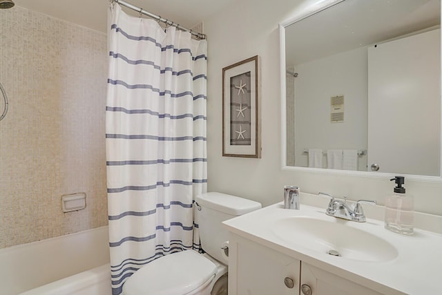 bathroom featuring vanity, toilet, and shower / bath combo with shower curtain