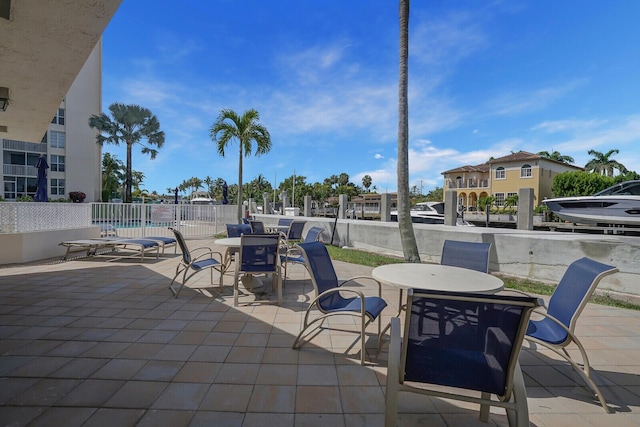 view of patio / terrace featuring outdoor dining space and fence