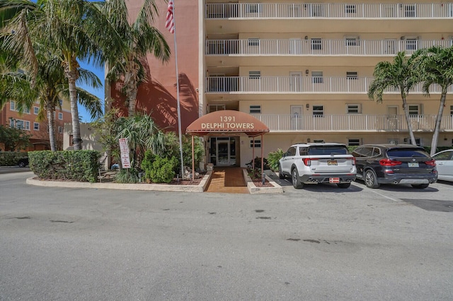 view of property featuring uncovered parking