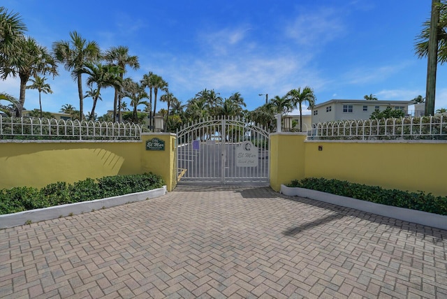 view of gate featuring fence