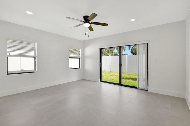 spare room featuring recessed lighting, ceiling fan, and baseboards