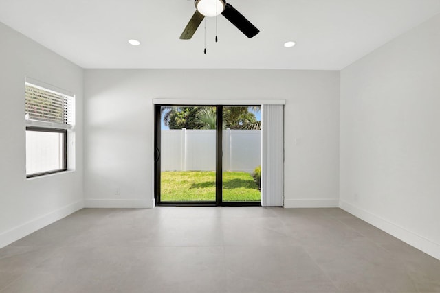 empty room featuring ceiling fan, recessed lighting, and baseboards