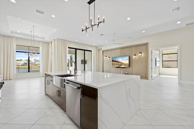 kitchen with visible vents, a sink, stainless steel dishwasher, and modern cabinets