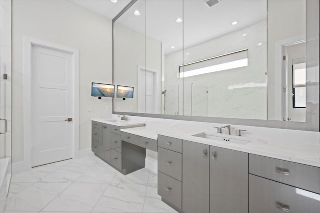 full bathroom with marble finish floor, a marble finish shower, recessed lighting, visible vents, and vanity