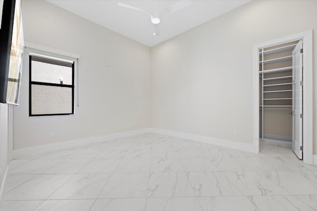 empty room with marble finish floor and baseboards