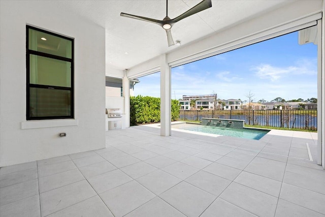 unfurnished sunroom with a water view and a ceiling fan