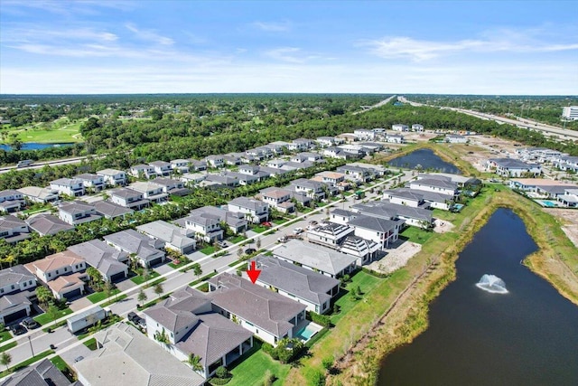 bird's eye view featuring a water view and a residential view