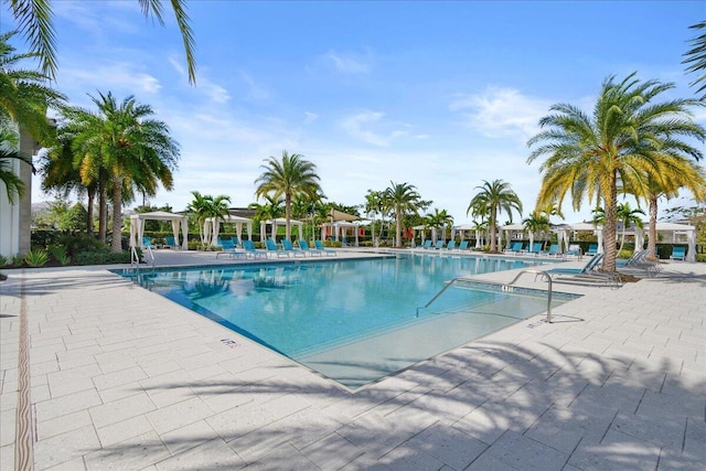 community pool featuring a patio area