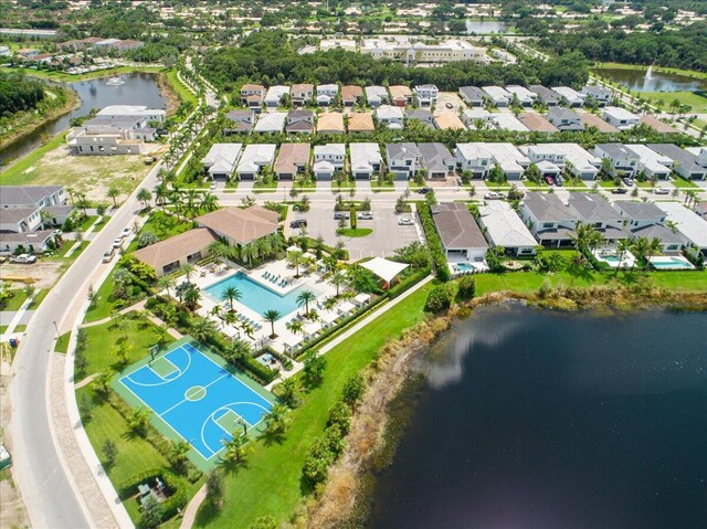 birds eye view of property with a water view and a residential view