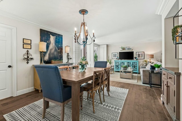dining space with dark wood-type flooring, baseboards, a chandelier, and crown molding