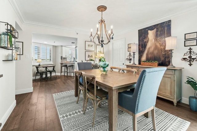 dining room featuring an inviting chandelier, dark wood-type flooring, baseboards, and ornamental molding